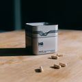 Hē Labs Unwind capsules - adaptogen stress supplement for men's composure and cortisol balance